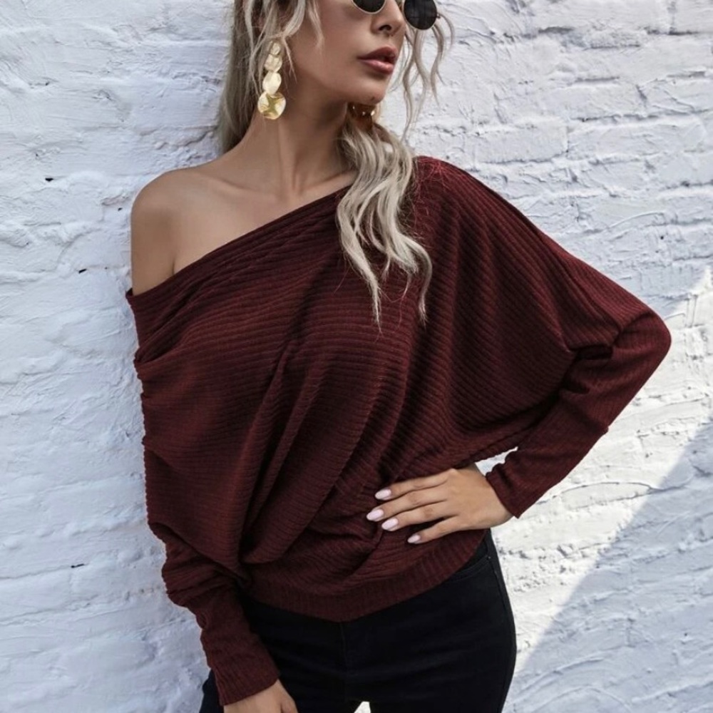 Brand new. Never worn off the shoulder sweater